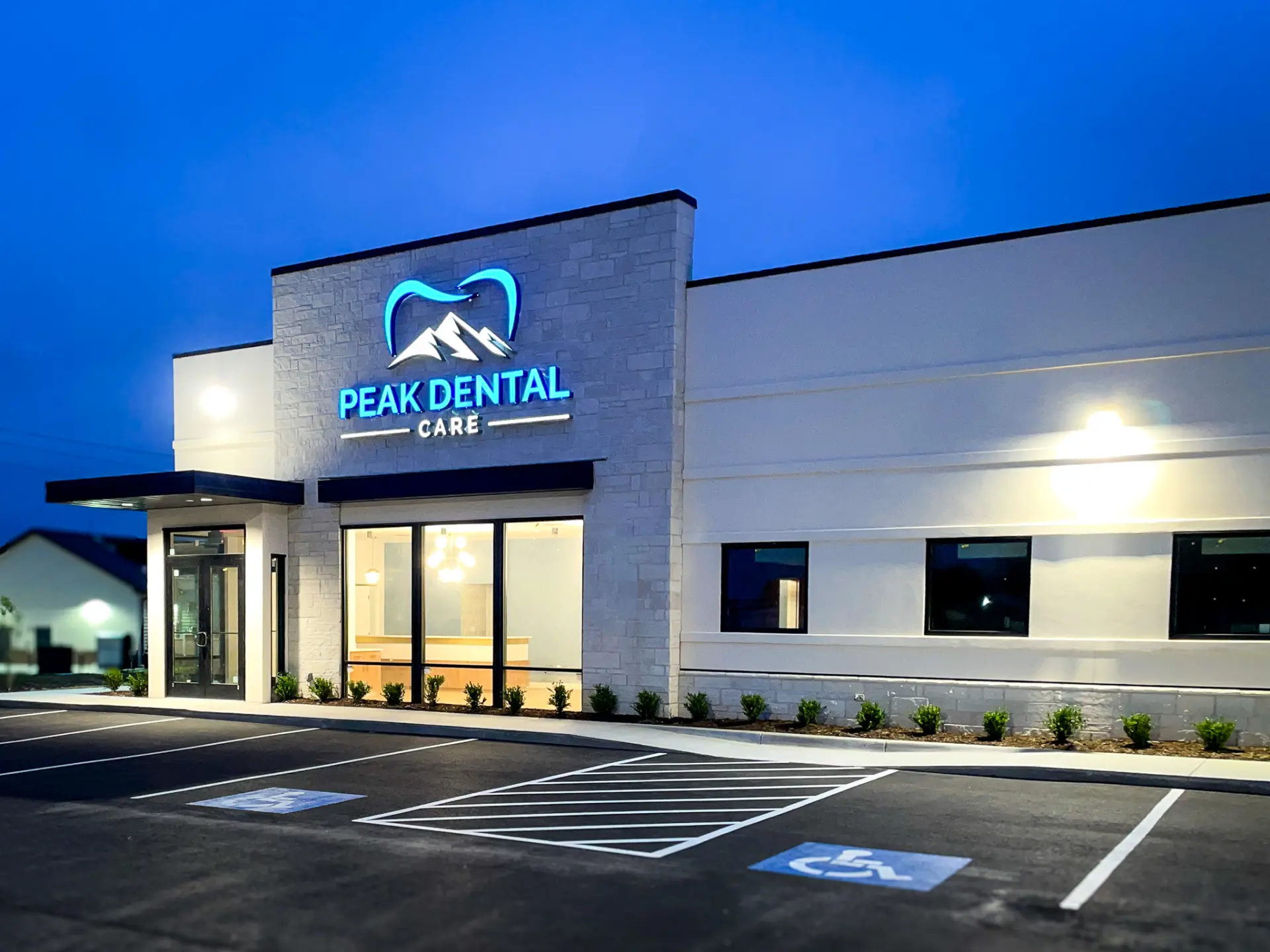Peak Dental Care building at dusk in Pea Ridge, Arkansas